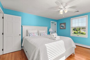 A bedroom with a bed, a ceiling fan, a window with blinds, and a door. - Water Views Private Pool, Hot Tub, Access to Cove! (West Dennis)