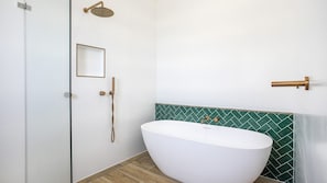 Bathtub, hair dryer, towels