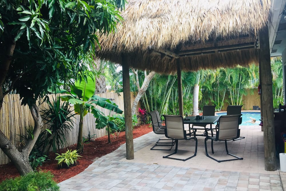 This is a lovely home in a quiet family neighborhood, with many family friendly features. There are 4 TVs with cable and Netflix ,smart TVs .Internet is through Xfinity and has a strong WIFI signal throughout the house. There is free parking; 2 spots depending on vehicle size. The house is very private with a private fenced-in back yard , where guests can lounge by and swim in the warm pool and catch plenty of sun, its great for evening family Fun under a tropical tiki hut <br>We are located 20 min from the Ft <br>Lauderdale airport and walking distance to Federal Highway #1, which has many great bars, shops publix and restaurants<br>The neighborhood is clean and quiet great for a walks . The ocean is a short drive ,and is full of fantastic clubs, bars and restaurants.<br> Summer family fun in heated pool and tiki hut