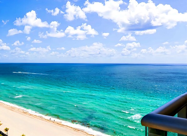 On the beach, sun-loungers, beach towels - Private Beachfront Condominium with Breathtaking Views and Resort Access (Sunny Isles Beach)