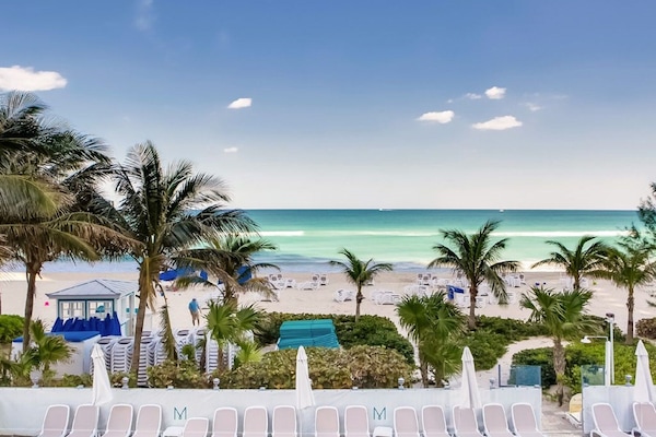 On the beach, sun-loungers, beach towels