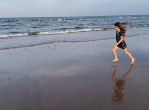 On the beach, sun-loungers, beach umbrellas, beach towels