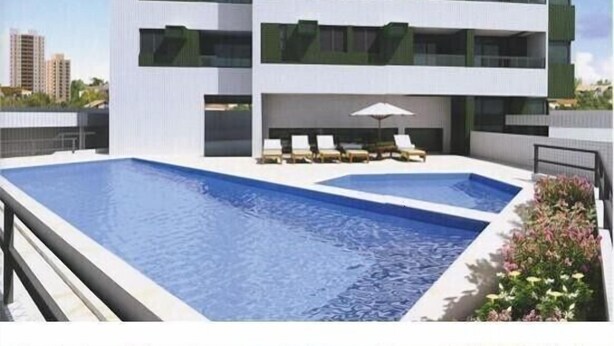 A modern building with a rooftop pool area, including lounge chairs and an umbrella. - Modern apartment, beautifully decorated and furnished, with swimming pool and Wi-Fi. (Recife)