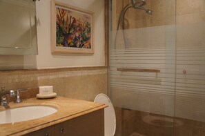 Shower, hair dryer, towels, toilet paper