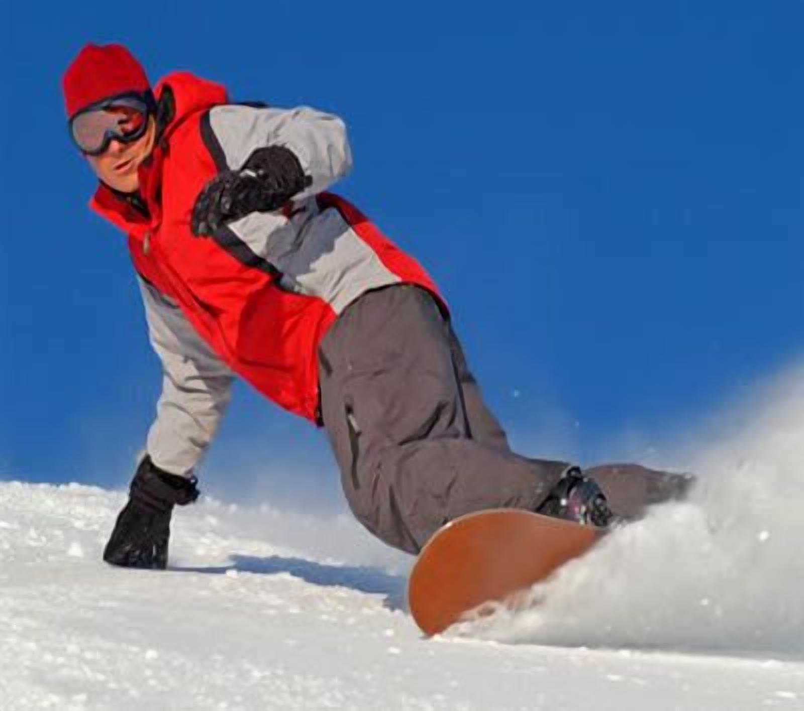 A person snowboarding on a clear day.
