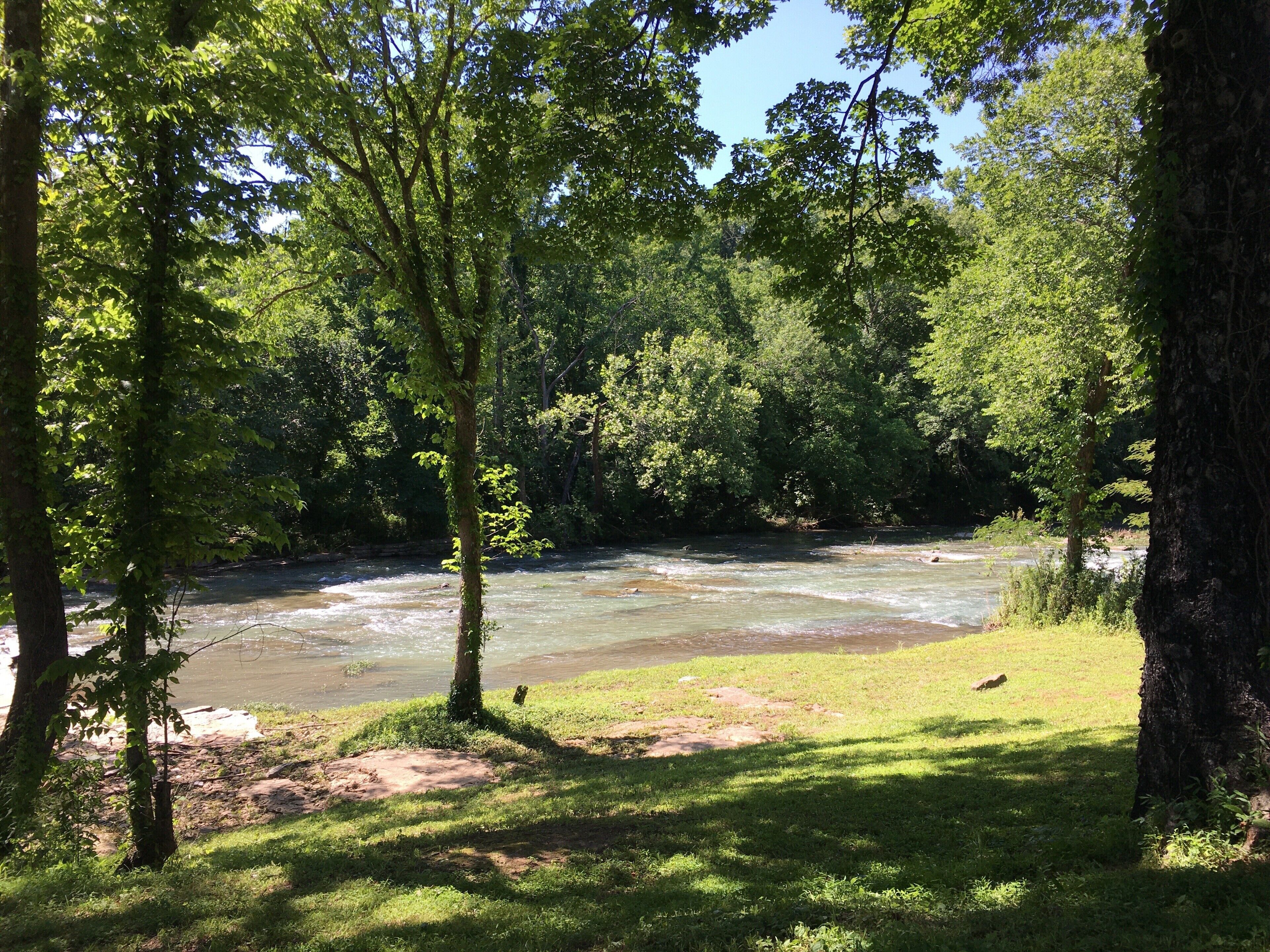 View of river. Large flat rocks great for sitting, relaxing, fishing, etc.