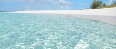 On the beach, sun loungers, beach towels