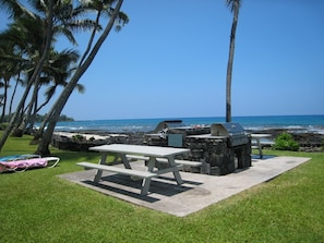 Enjoy al fresco dining in a designated outdoor space with a picnic table and barbecue grill.