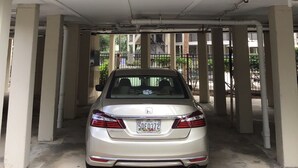A multi-level parking garage with a car parked under the second level. - Summer is booking fast! Please book soon. New paint and upgrades!!! (Hilton Head Island)