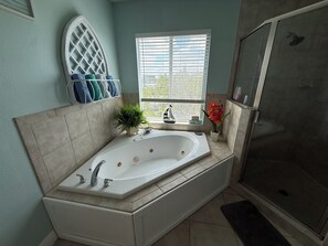 Jetted tub, hair dryer, towels, soap