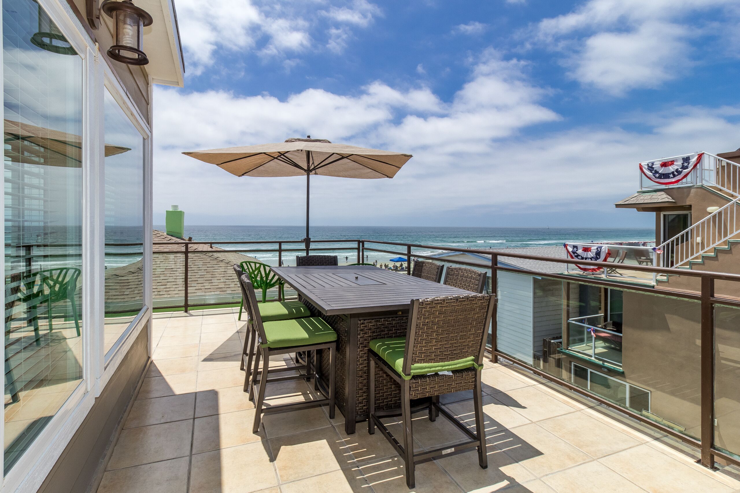 Spacious Balcony with Ocean View, large dining table and BBQ