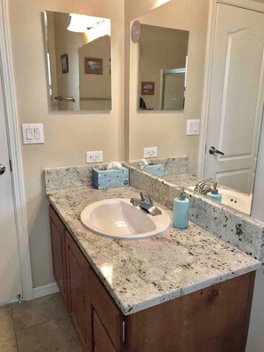 Combined shower/bathtub, hair dryer, towels, soap