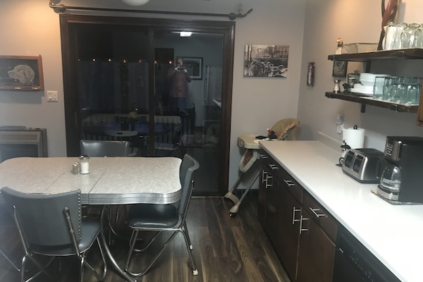 Kitchen with door to screened in porch.