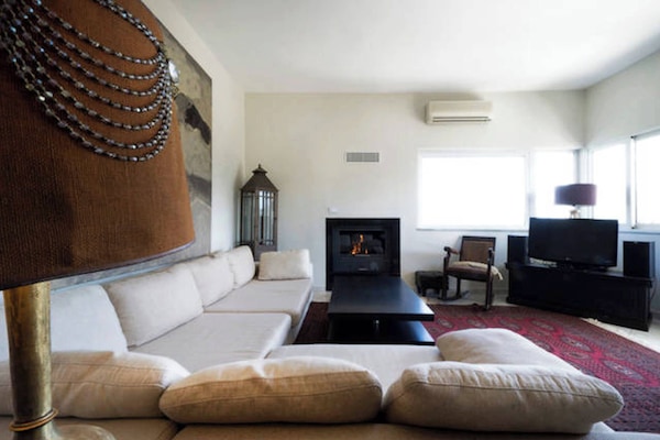 living room with big corner sofa, fire place, T.V.,DVD, P.S.3, stereo & seaview