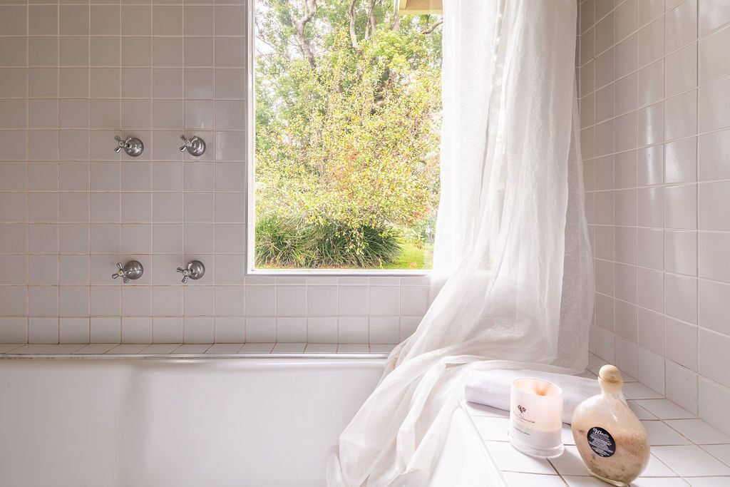 Back bathroom with bath overlooking back garden