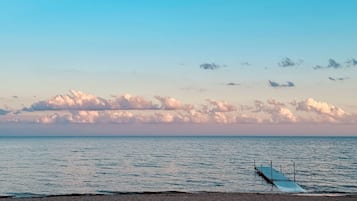 On the beach, sun loungers, beach towels