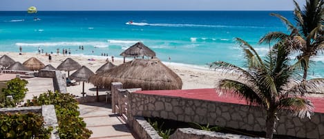 On the beach, sun loungers, beach towels