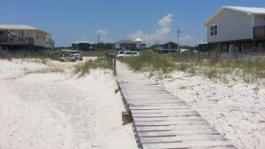 A sandy beach path leading to beachfront houses with a clear sky. - Great Gulf Views and easy walk to the beach.  Dog Friendly! (Gulf Shores)