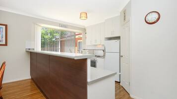 Coffee/tea maker, fridge, microwave, oven