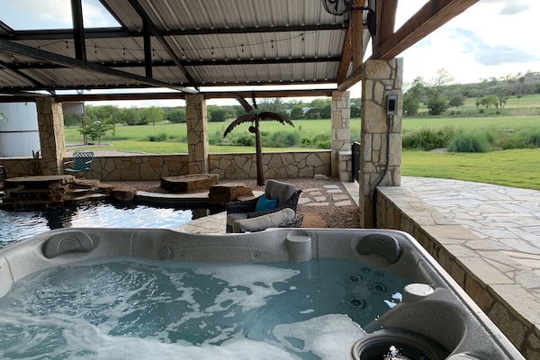 Year round lighted hot tub with a view. Freestanding, next to the pool.