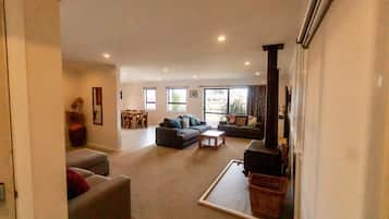Smart TV, fireplace, table football, books