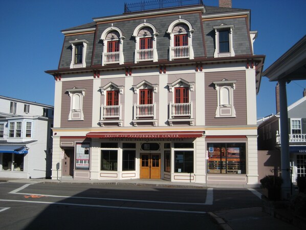 A two-story building with a sign for 'Shalin Liu Performance Center' at the ground level.