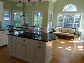 Enjoy cooking in the well-equipped kitchen with a gas stove and ample counter space, then dine or relax in the adjacent areas.