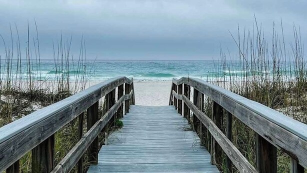 A wooden boardwalk leading to a beach with ocean views. - Slow Mo 17AD-Beautiful Beach Cottage @ the Purple Parrot Resort/Perdido Key FL (Pensacola)
