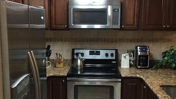 Coffee/tea maker, fridge, microwave, oven
