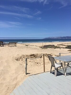 On the beach, sun-loungers