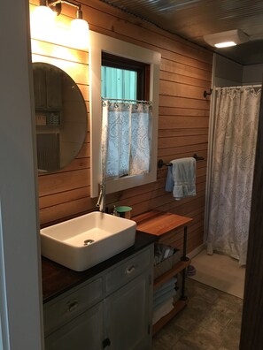 Shower, towels, soap, toilet paper