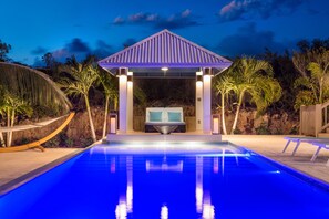 A heated pool, pool loungers