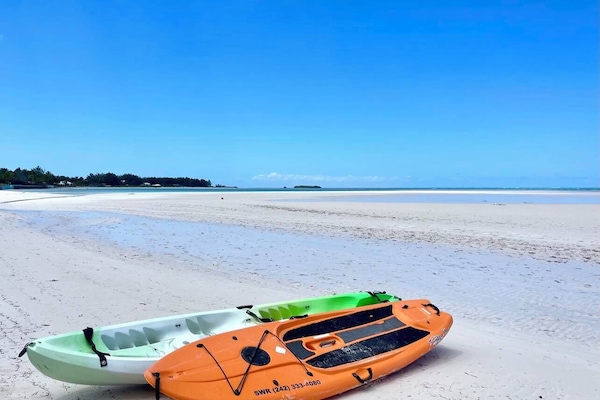 Kayak & Paddleboard provided at By the Seashore- just steps away to the beach!