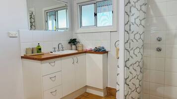 Shower, hair dryer, towels, soap