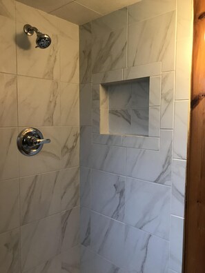 Combined shower/bathtub, hair dryer, towels, soap