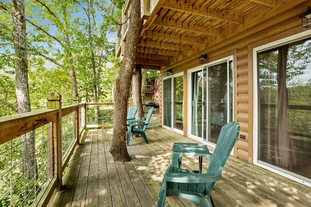 Deck 50' over river bottom.  Sliding doors into bedrooms.
