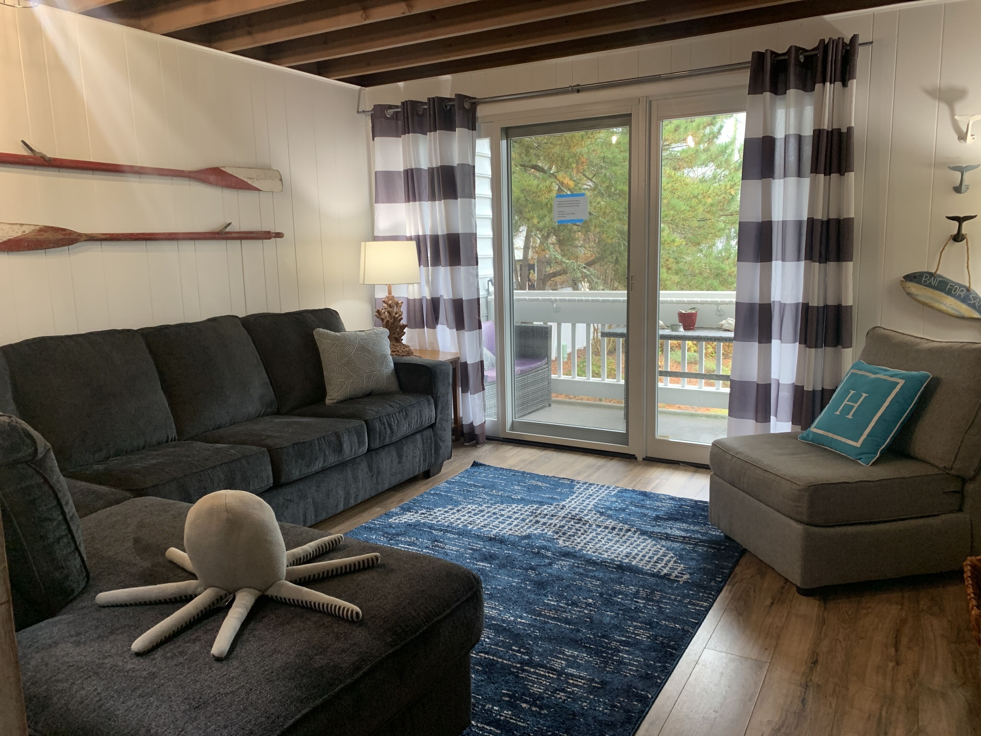 Family room with balcony overlooking shared pool.