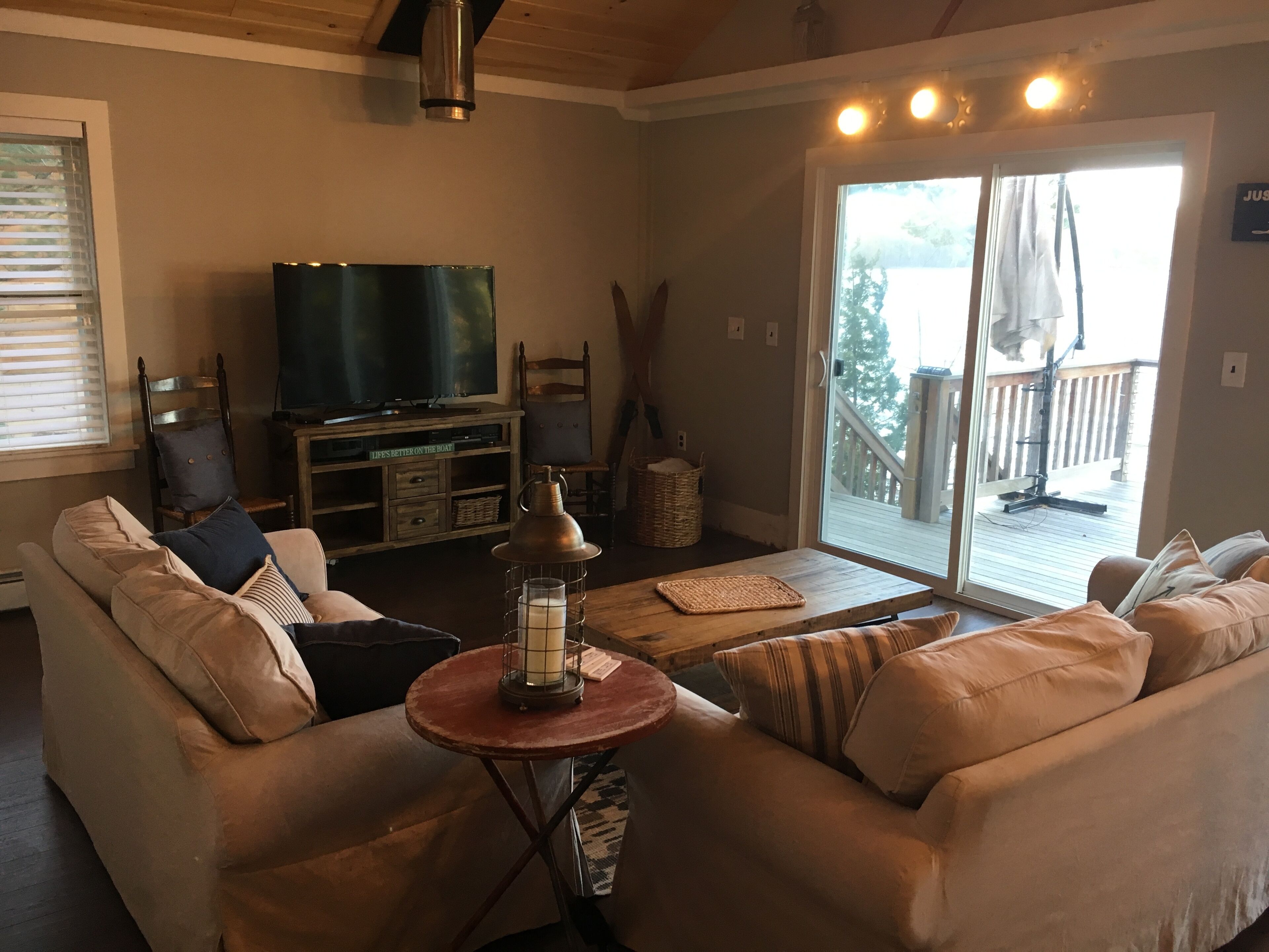 Lake Winnisquam home with beach and private boat dock. 15 minutes to Gunstock.