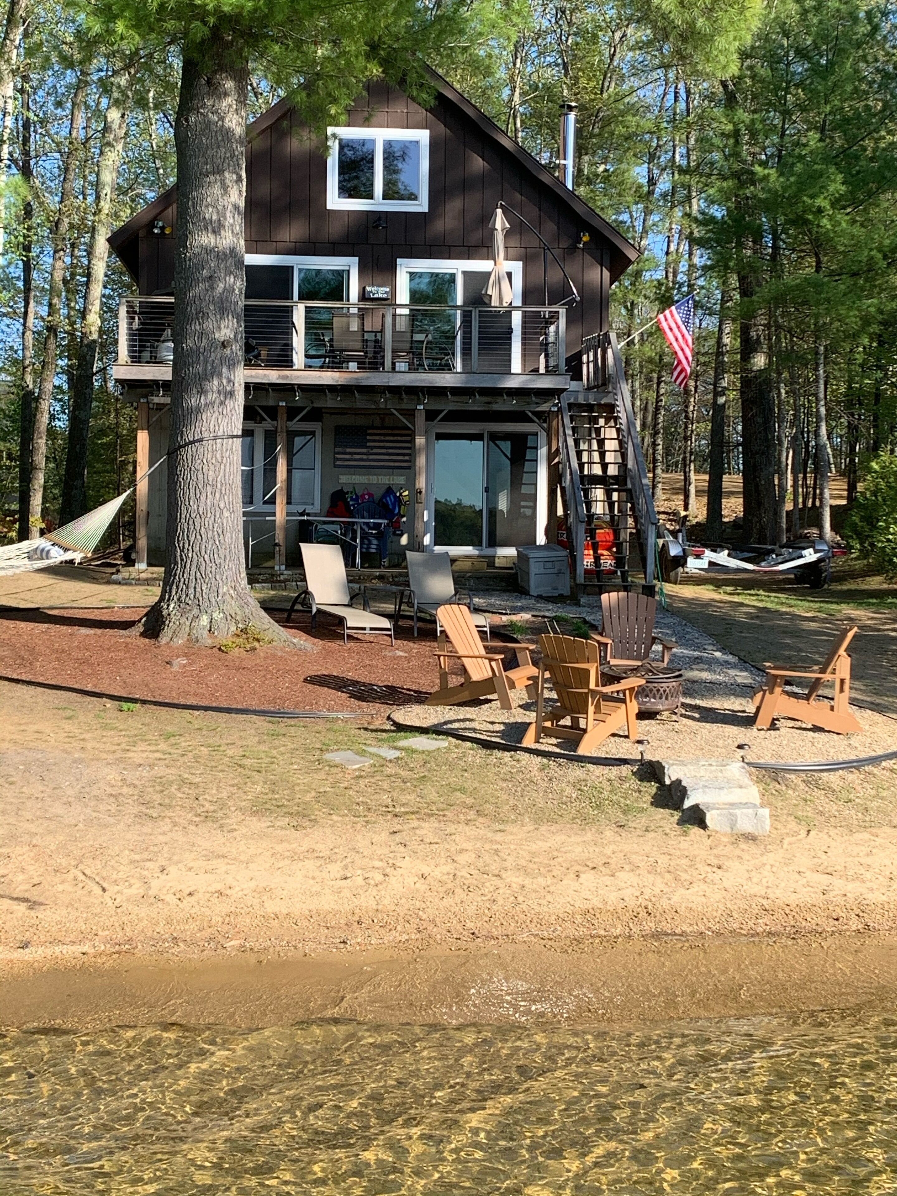 Lake Winnisquam home with beach and private boat dock. 15 minutes to Gunstock.
