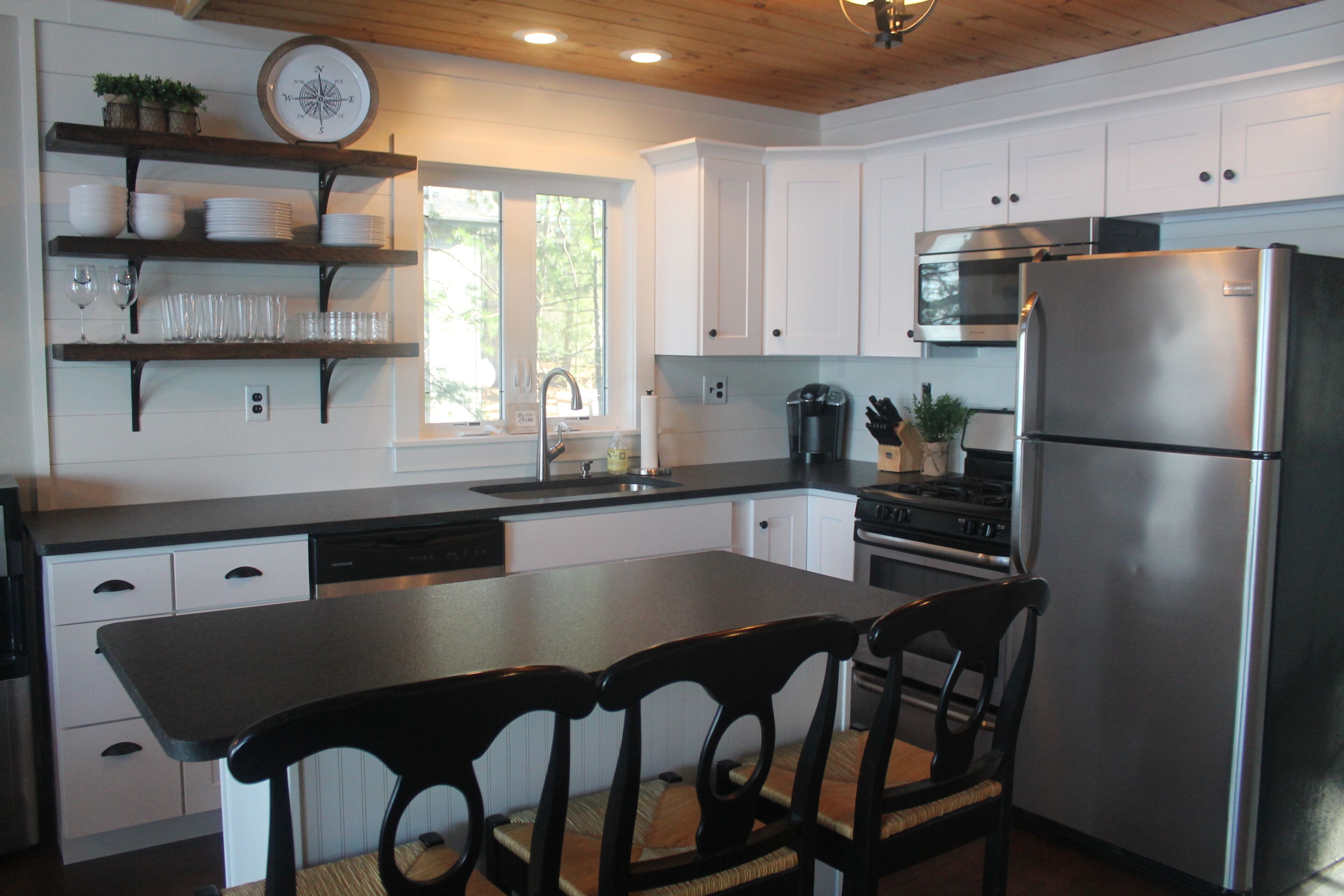 Lake Winnisquam home with beach and private boat dock. 15 minutes to Gunstock.