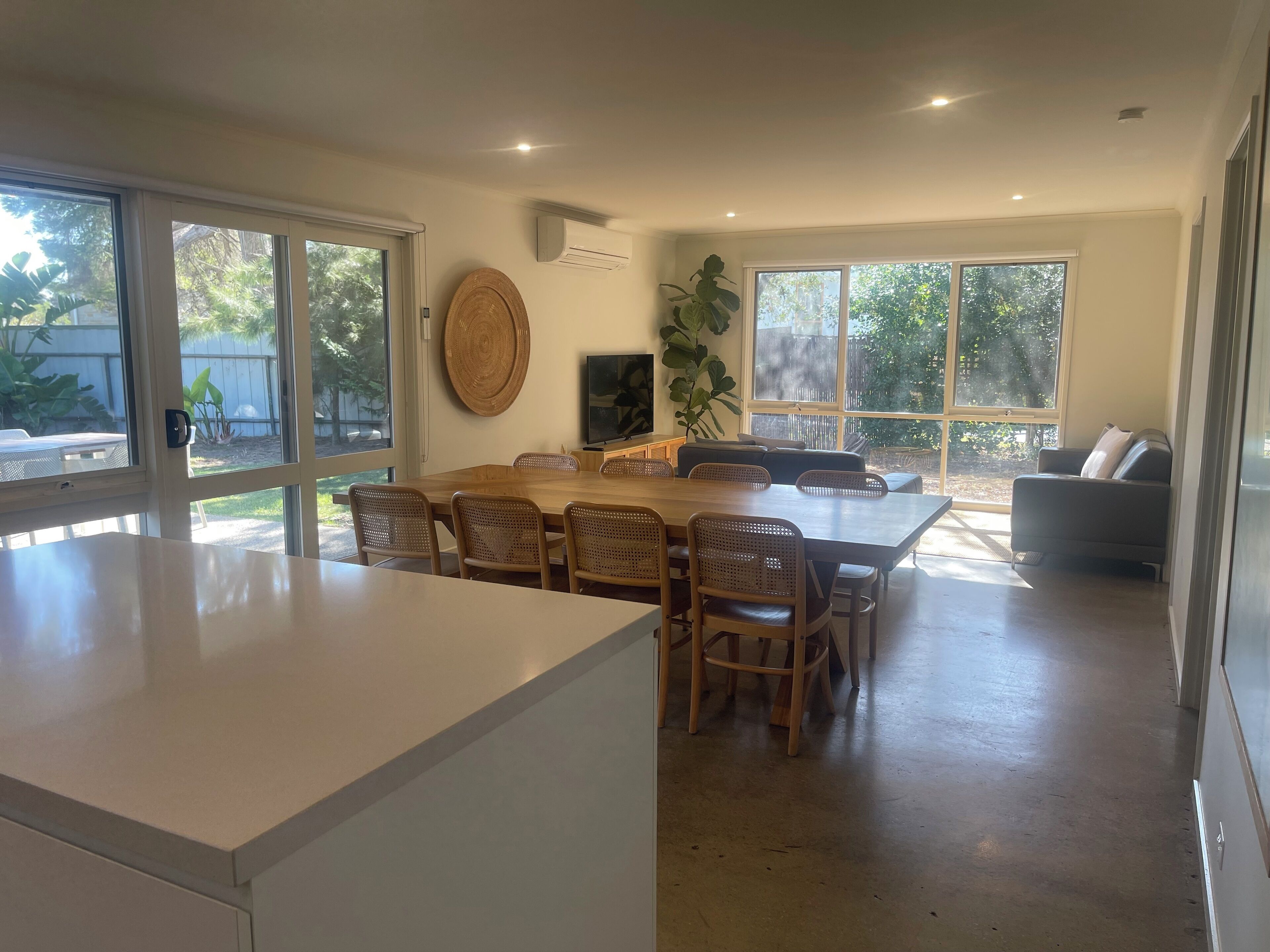 Open plan living and dining area with direct access to large backyard