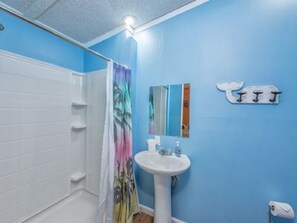 Bathtub, hair dryer, towels