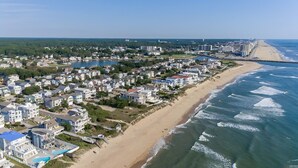 An aerial view of a coastal residential area with houses, a beach, and a marina. - Big Kitchen, Two Masters, Hot Tub, Short Walk from Croatan Beach (Virginia Beach)
