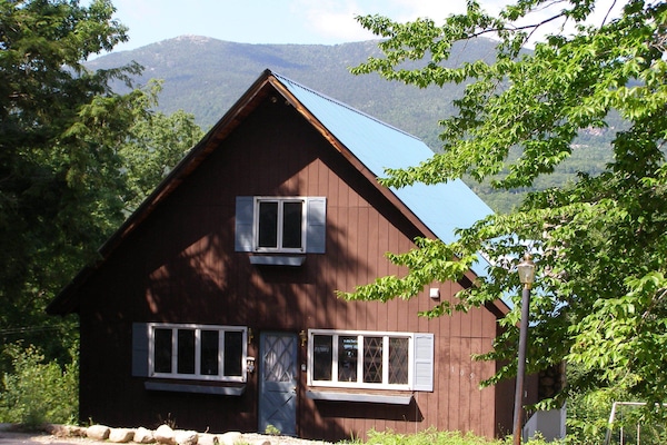 Our home nestling in the verdant scene with the Moats in the distance