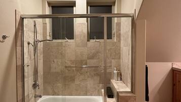 Combined shower/tub, towels, soap, shampoo