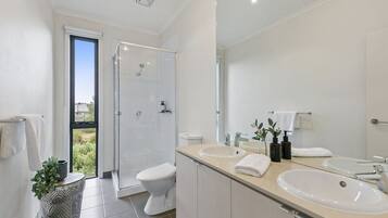 Bathtub, hair dryer, towels, soap