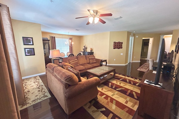 Spacious living room with comfortable couch.