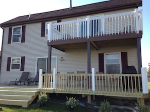 Enjoy outdoor dining or relaxation on the balcony with a table and chairs.