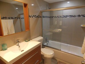 Combined shower/bathtub, hair dryer, towels, soap
