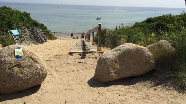 A sandy beach with a wooden staircase leading to a wooden deck overlooking the sea. - Adorable 3 bed cottage - 2 blocks to private beach; pond; AC, pets ok (Plymouth)